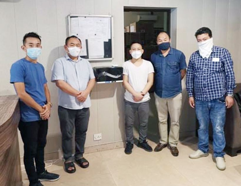 Mhaleu Metha and Kesosilie Kennao with officials during the installation of automatic hand sanitizer dispenser at Nagaland House, New Delhi. (Photo Courtesy: PRO New Delhi)